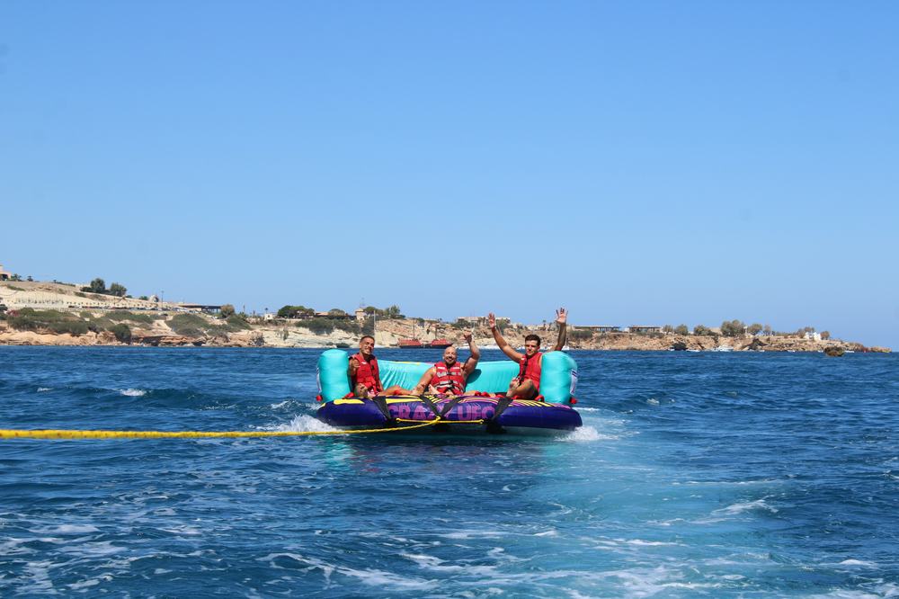 Three guests standing on the inflatable