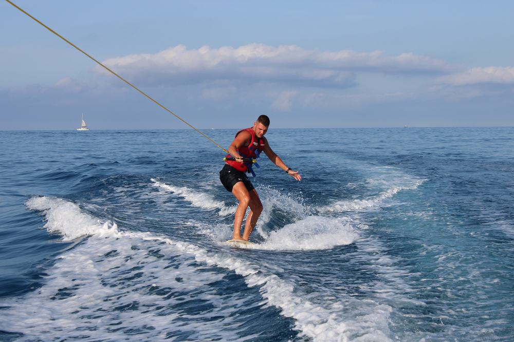 Wakeboarder carving through the wake